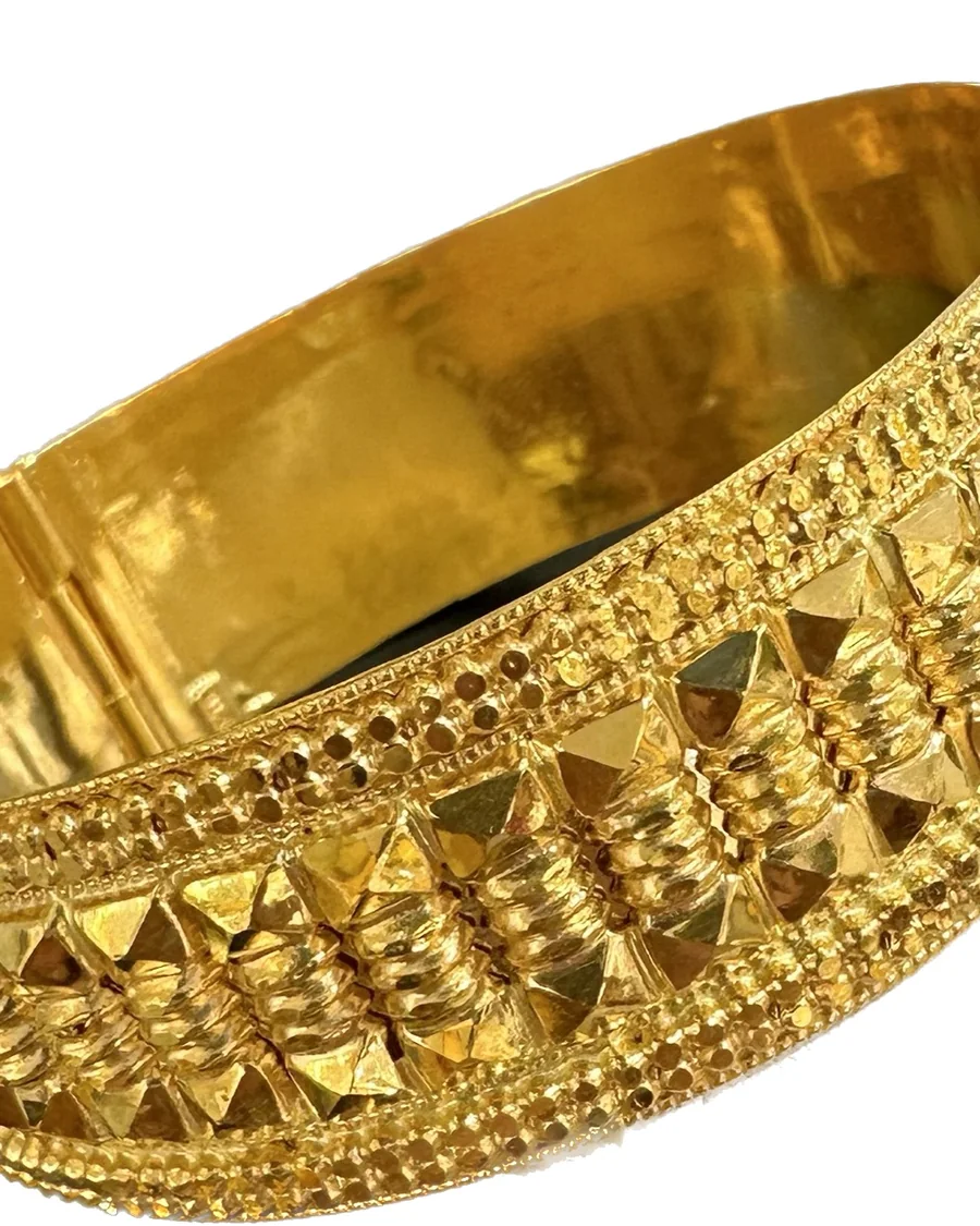 Close-up of a gold keke bangle