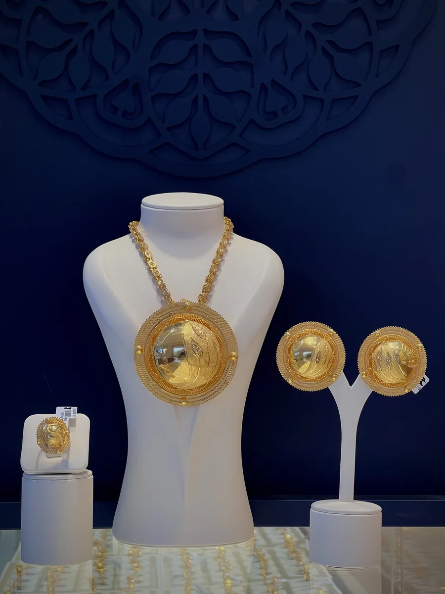 Habesha domed-disc pendant set in gold